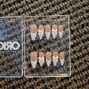 Elegant Nude and White Press-On Nails with Bow Design